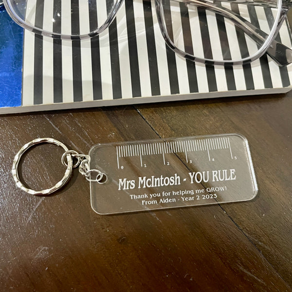 Personalised engraved acrylic keychain with custom text, handmade gift by Mudpuddles Australia
